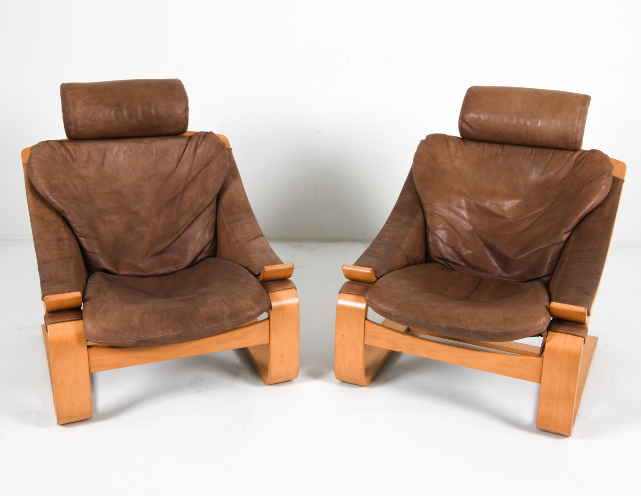 Artwork by Ake Fribyter, PAIR OF AKE FRIBYTTER BEACH LOUNGE CHAIRS, Made of Bentwood beech frames with tan leather upholstery