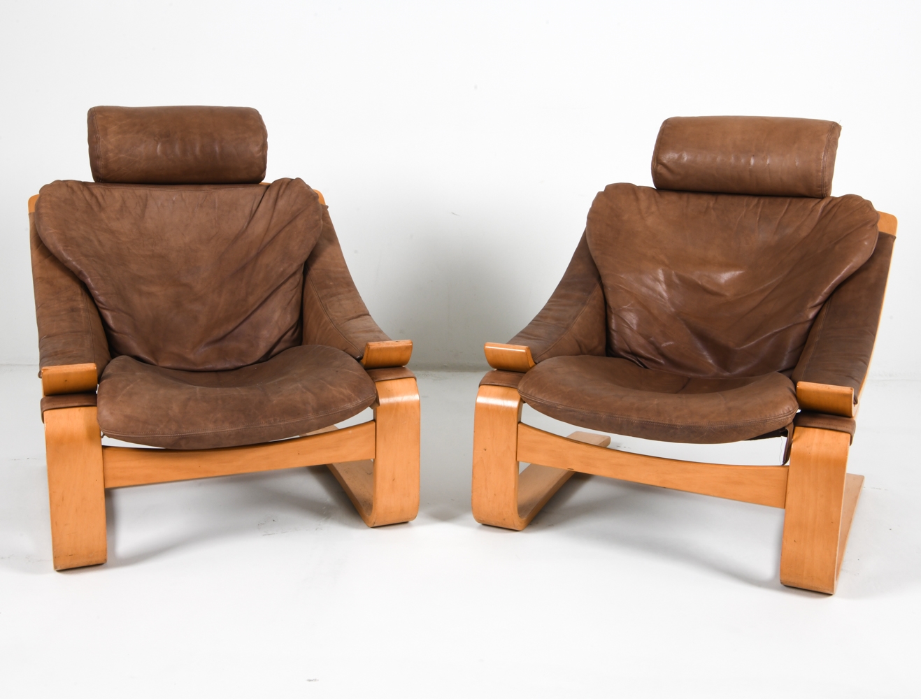 Artwork by Ake Fribyter, PAIR OF AKE FRIBYTTER BEACH LOUNGE CHAIRS, Made of Bentwood beech frames with tan leather upholstery
