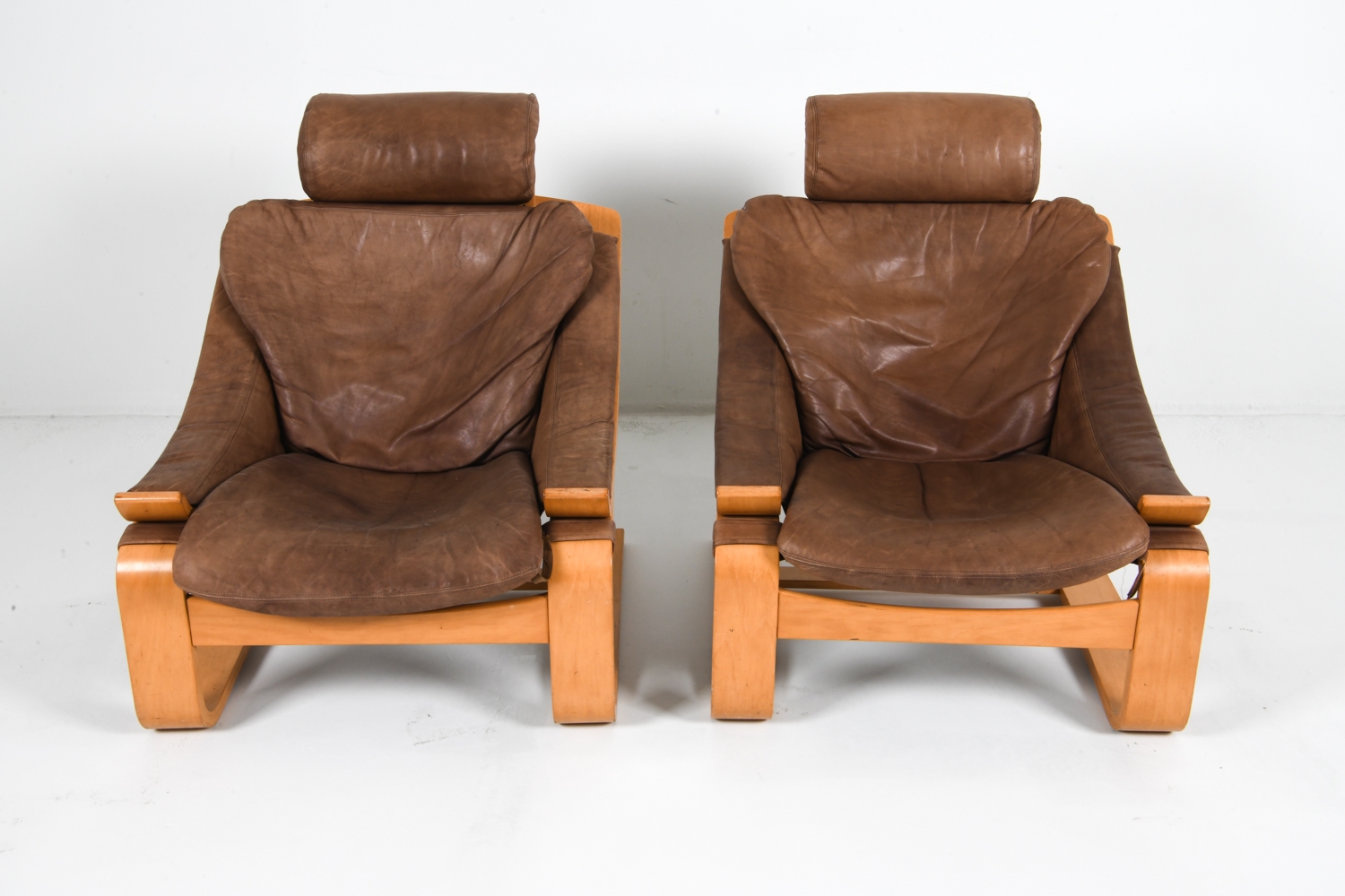 Artwork by Ake Fribyter, PAIR OF AKE FRIBYTTER BEACH LOUNGE CHAIRS, Made of Bentwood beech frames with tan leather upholstery
