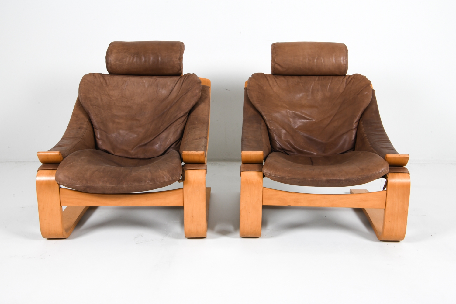 Artwork by Ake Fribyter, PAIR OF AKE FRIBYTTER BEACH LOUNGE CHAIRS, Made of Bentwood beech frames with tan leather upholstery