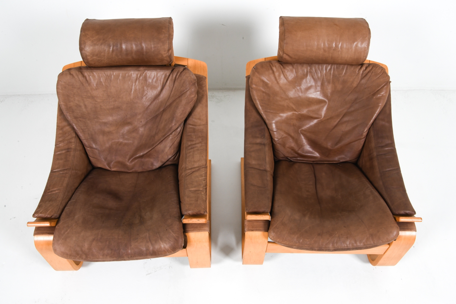 Artwork by Ake Fribyter, PAIR OF AKE FRIBYTTER BEACH LOUNGE CHAIRS, Made of Bentwood beech frames with tan leather upholstery