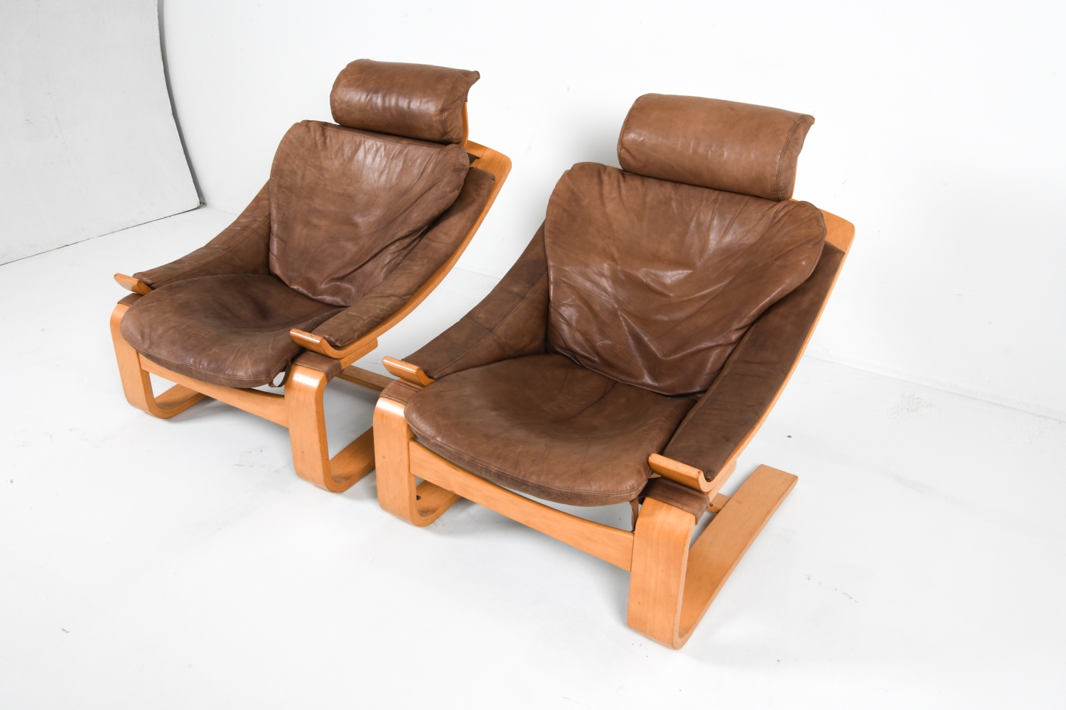 Artwork by Ake Fribyter, PAIR OF AKE FRIBYTTER BEACH LOUNGE CHAIRS, Made of Bentwood beech frames with tan leather upholstery