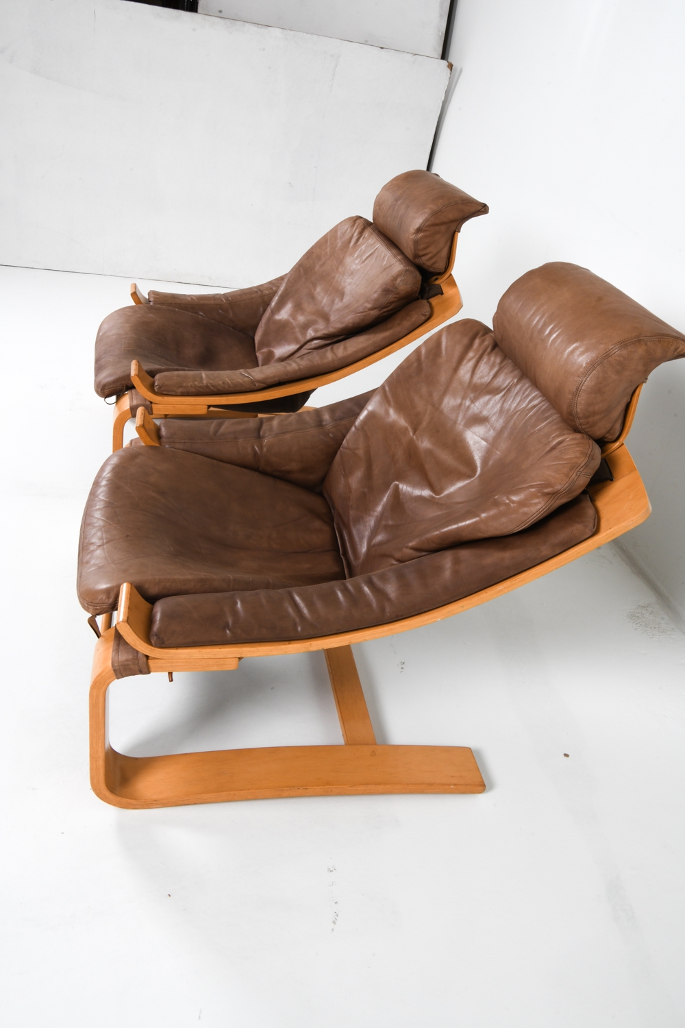 Artwork by Ake Fribyter, PAIR OF AKE FRIBYTTER BEACH LOUNGE CHAIRS, Made of Bentwood beech frames with tan leather upholstery
