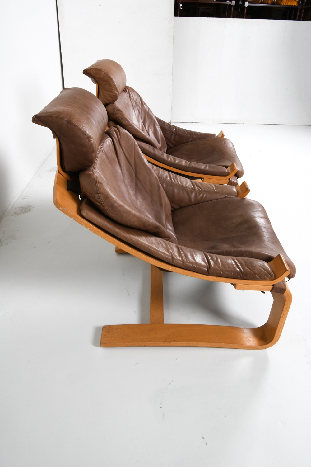 Artwork by Ake Fribyter, PAIR OF AKE FRIBYTTER BEACH LOUNGE CHAIRS, Made of Bentwood beech frames with tan leather upholstery