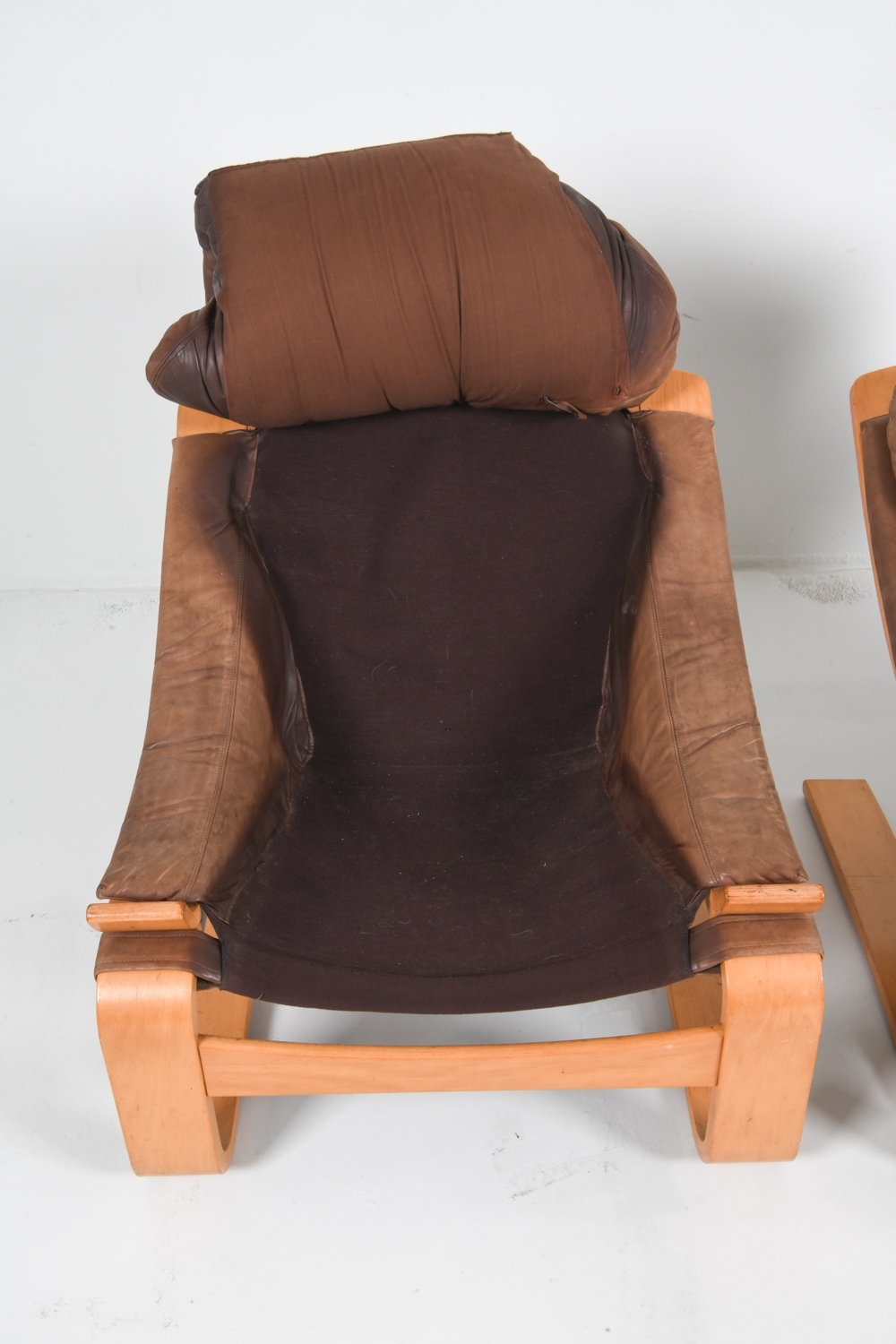 Artwork by Ake Fribyter, PAIR OF AKE FRIBYTTER BEACH LOUNGE CHAIRS, Made of Bentwood beech frames with tan leather upholstery