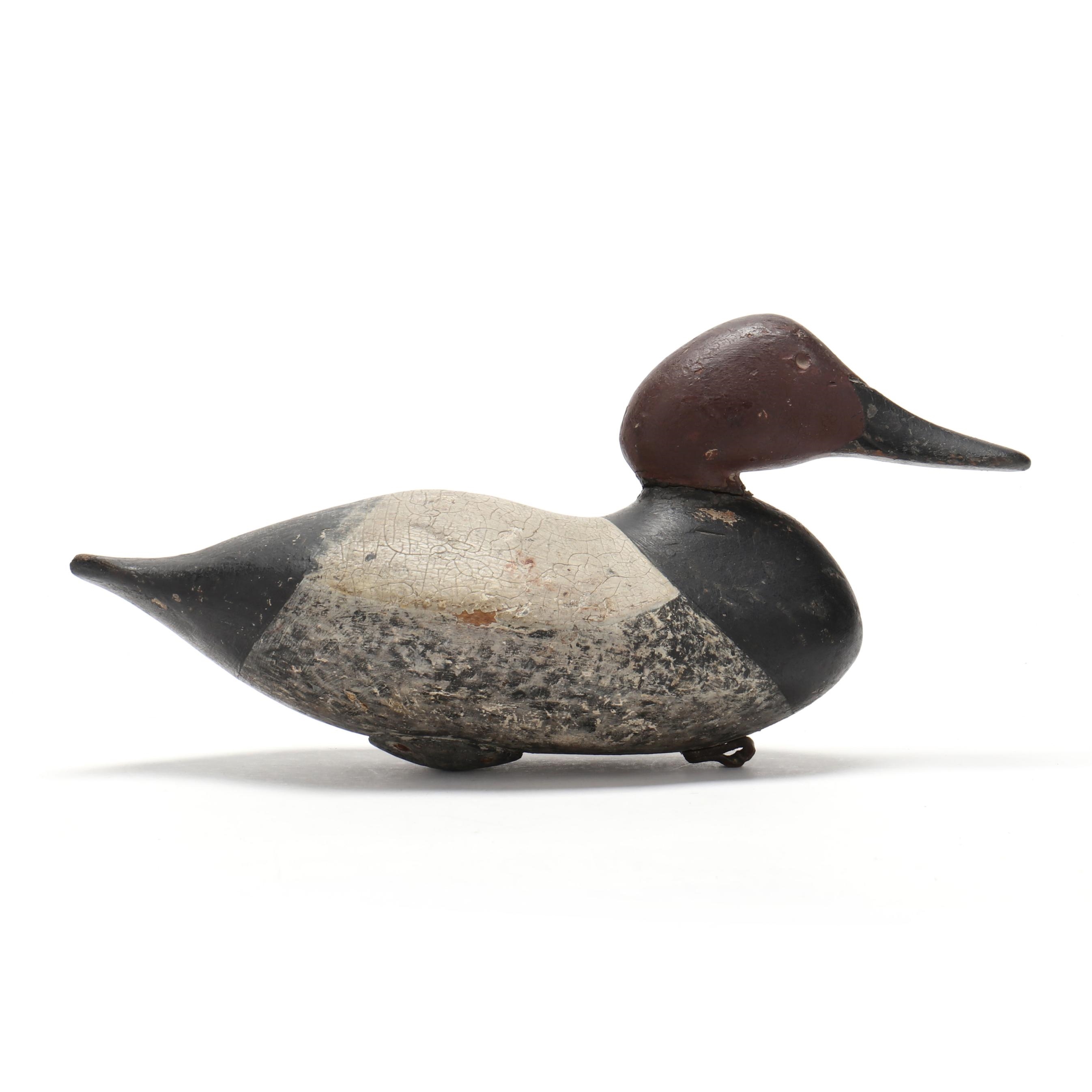 Artwork by Mitchell Fulcher, Canvasback, Made of carved and painted wood, glass