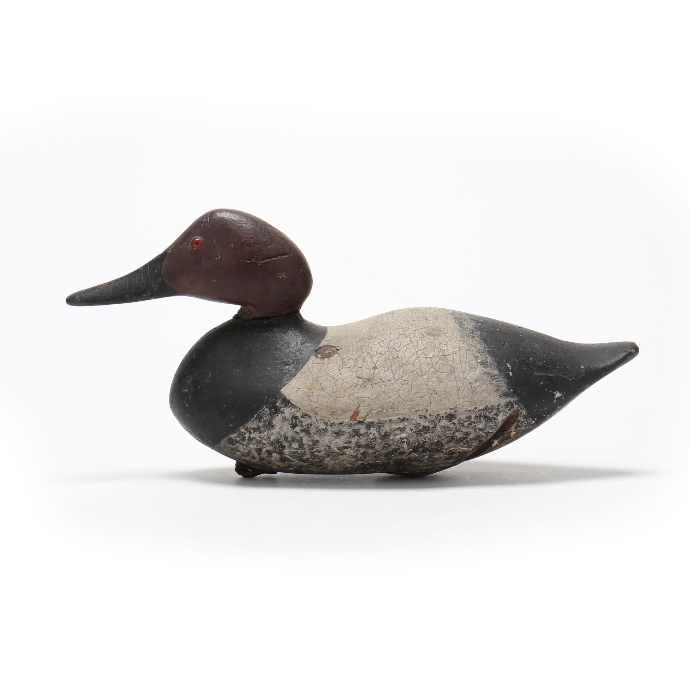 Artwork by Mitchell Fulcher, Canvasback, Made of carved and painted wood, glass