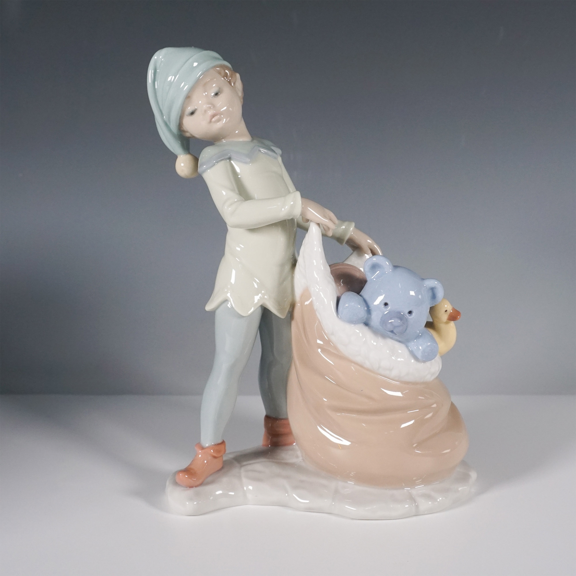 Artwork by José Santaeulalia, Lladro Porcelain Figurine, Santas Sack of Dreams 1006894, Made of porcelain figurine