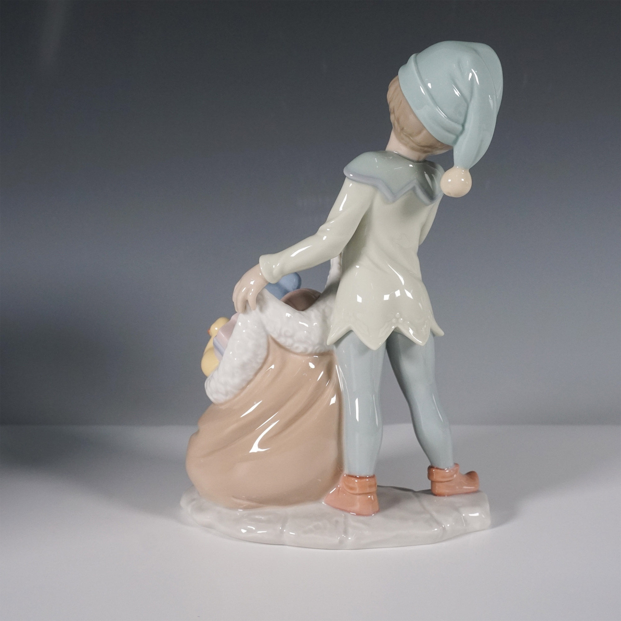 Artwork by José Santaeulalia, Lladro Porcelain Figurine, Santas Sack of Dreams 1006894, Made of porcelain figurine