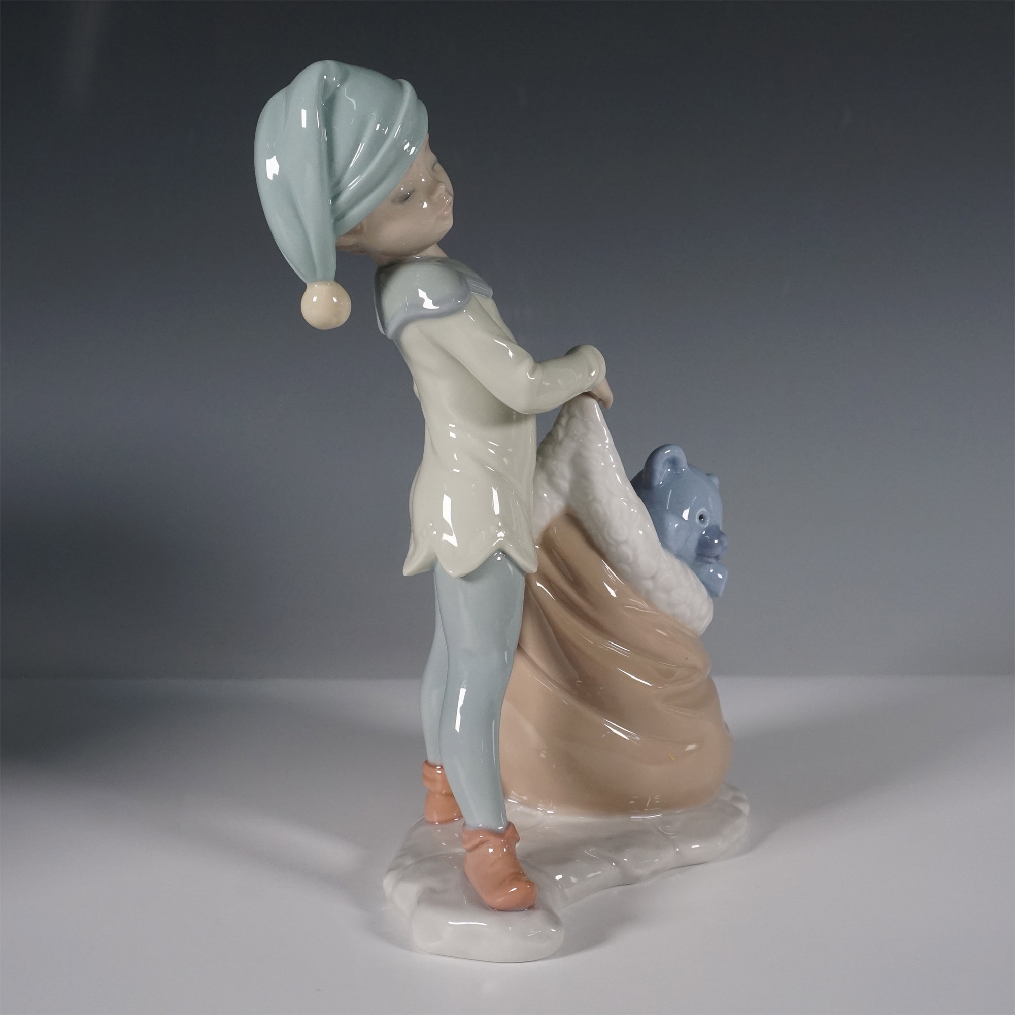 Artwork by José Santaeulalia, Lladro Porcelain Figurine, Santas Sack of Dreams 1006894, Made of porcelain figurine