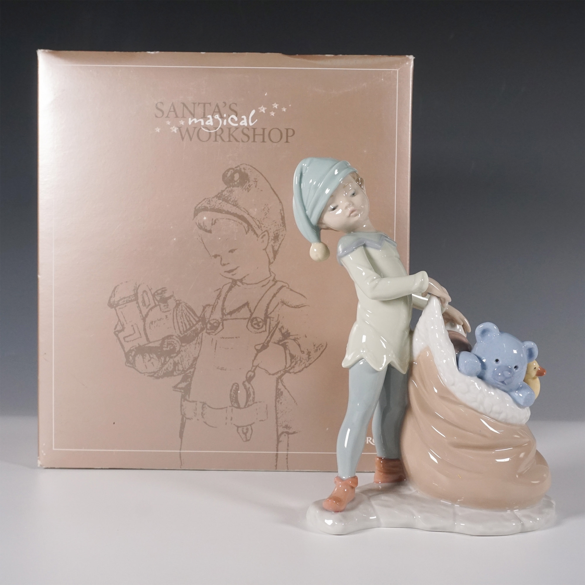 Artwork by José Santaeulalia, Lladro Porcelain Figurine, Santas Sack of Dreams 1006894, Made of porcelain figurine