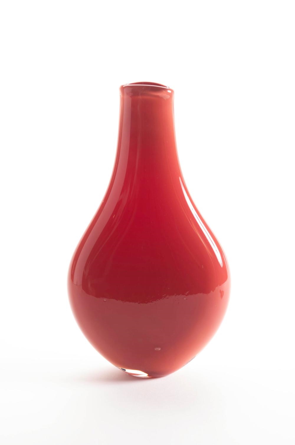Artwork by Steve Funk, Vase, Made of iron red blown glass with black and white stylized rosettes on front of flattened body