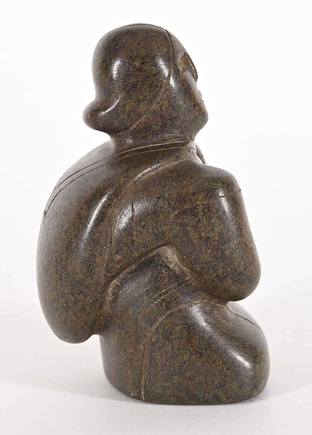 Artwork by Conlucy Nayoumealook, Untitled - Woman Crouched, Made of grey stone carving