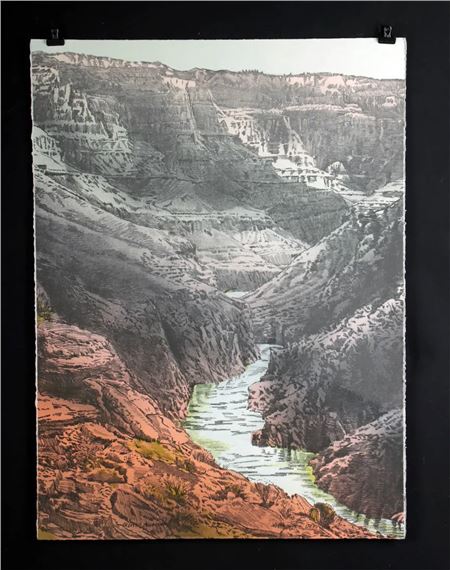 A picture of a river in the middle of a canyon.
