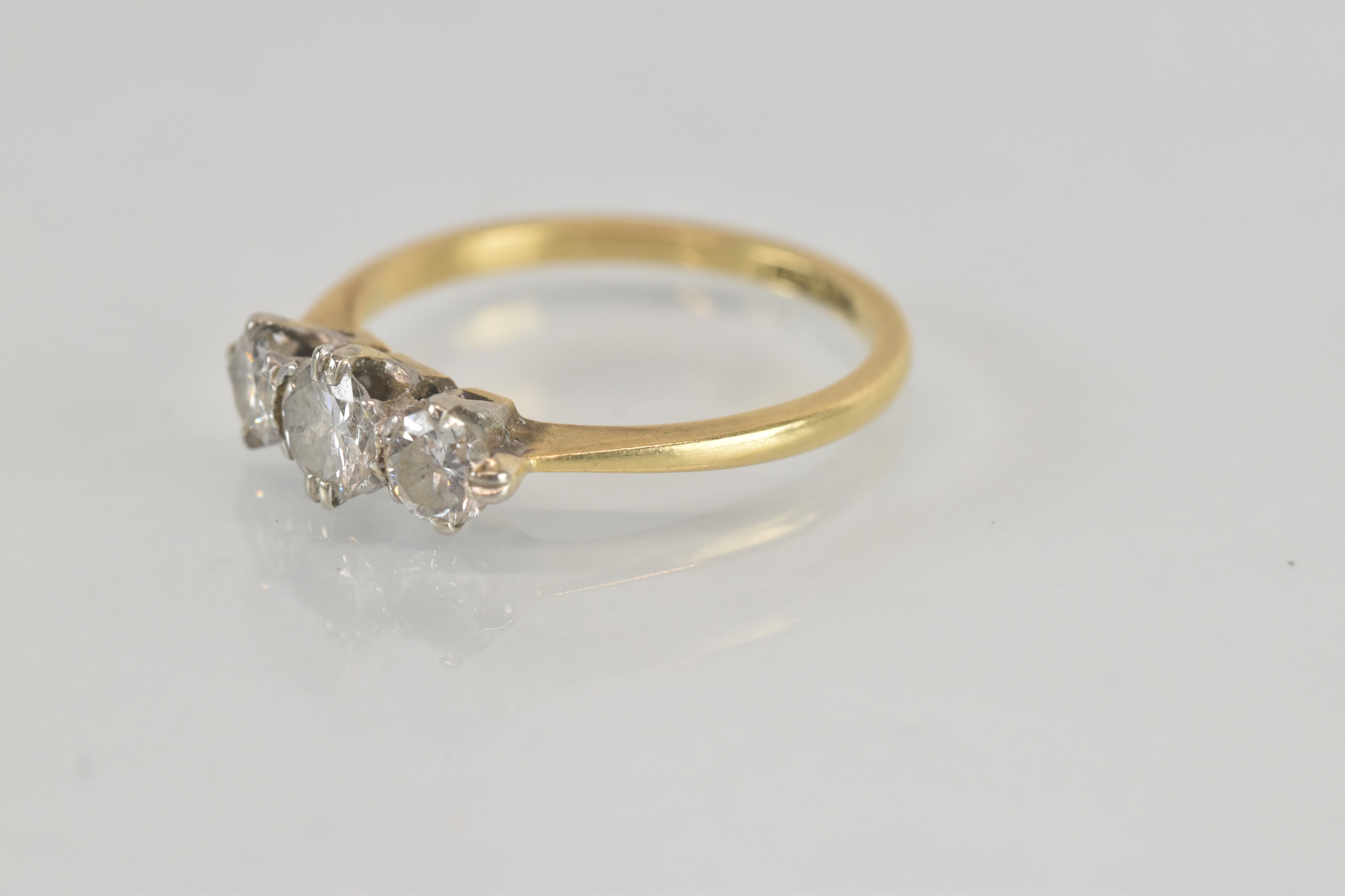 Diamond | the head set with three graduated diamonds in a platinum ...