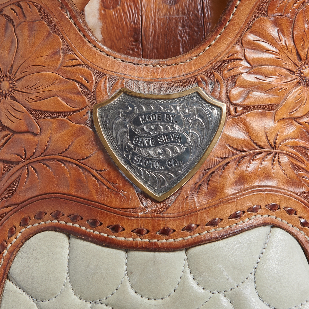 Artwork by Dave Silva, Dave Silva Sterling Silver Mounted Tooled Leather Saddle on Wood Stand, Made of Sterling Silver Mounted