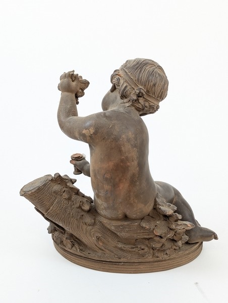 Artwork by Renè Rod, René ROD (XIX-XXe siècle) SCULPTURE en terre cuite dans le goût du XVIIIe représentant un enfant jouant avec une grappe de raisin. Signée Roll à l'arrière.  ;  (Manque), Made of Terracotta