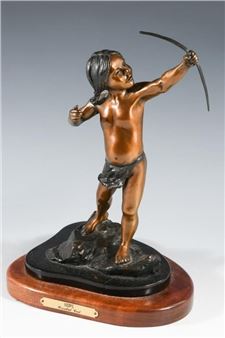 A bronze statue of a boy holding a bow and arrow.
