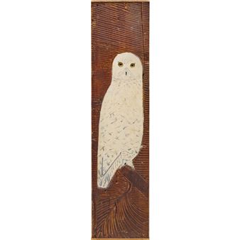 A hand-carved wooden panel featuring a white owl perched on a branch.