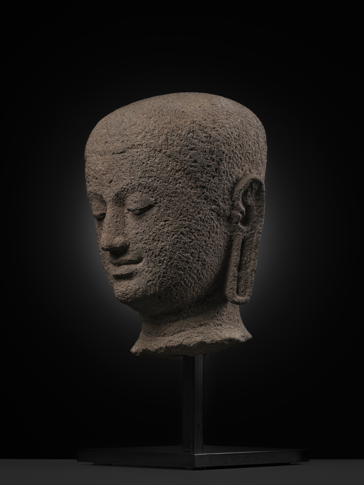 Javanese School | A RARE ANDESITE HEAD OF A BUDDHIST MONK, CENTRAL JAVA ...