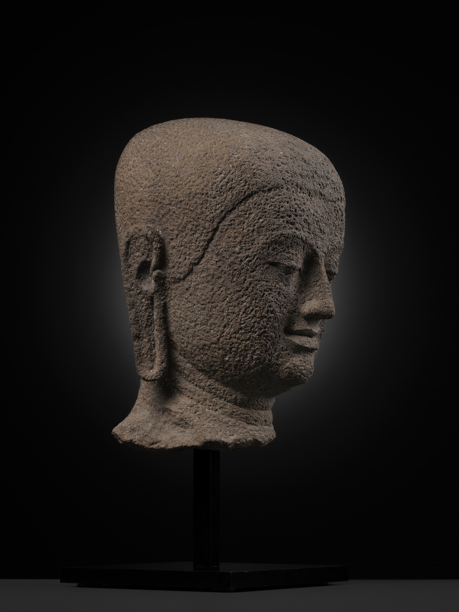 Javanese School | A RARE ANDESITE HEAD OF A BUDDHIST MONK, CENTRAL JAVA ...