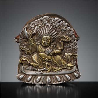 A PARCEL-GILT SILVER REPOUSSÉ ‘MAHAKALA’ GAU, BHUTAN, 18TH CENTURY - Bhutanese School, 18th Century