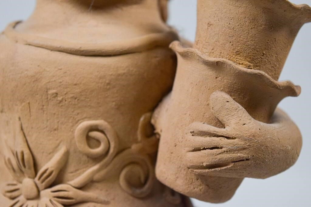 Artwork by Teodora Blanco Nunez, woman with baskets, Made of pottery