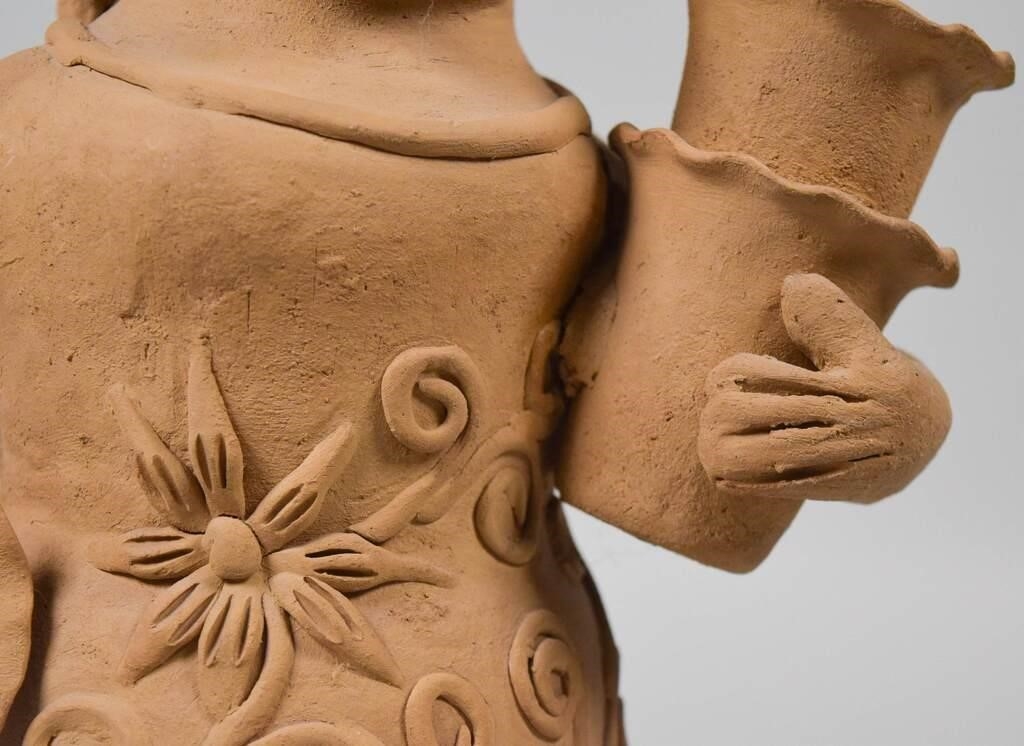 Artwork by Teodora Blanco Nunez, woman with baskets, Made of pottery