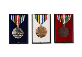 Set of three official winner medals: Gold, Silver, and Bronze for the Ice Hockey events of the X Winter Olympic Games - Roger Excoffon