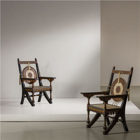 Two armchairs. Walnut, ebonized wood, fruitwood, bone, pewter, brass, painted parchment, embossed copper. Artist's studio, Paris, ca. 1900. by Chiara Bugatti, circa 1900