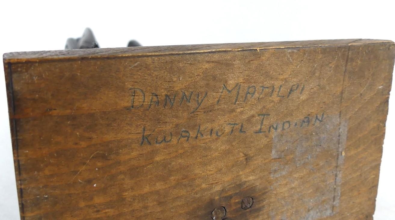 Artwork by Danny Matilpi, A carved wood totem pole with raven, Made of carved wood