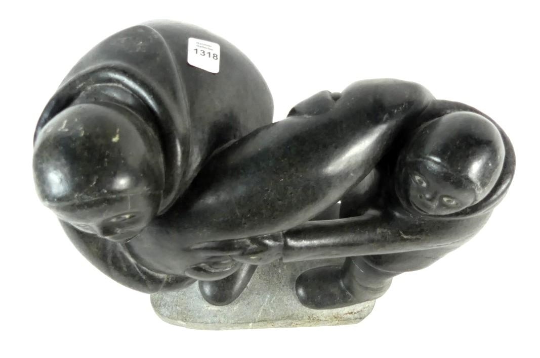 Artwork by Markusi Kuanana, A large-scale soapstone figural group carved in the form of two Inuit hunters holding seal, Made of soapstone