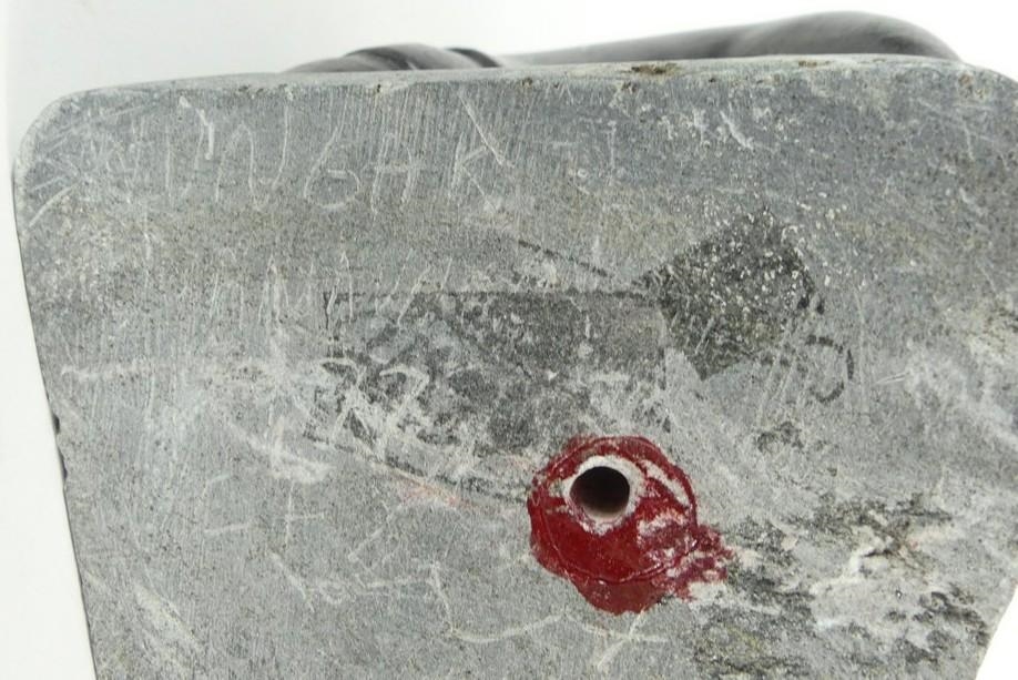 Artwork by Markusi Kuanana, A large-scale soapstone figural group carved in the form of two Inuit hunters holding seal, Made of soapstone