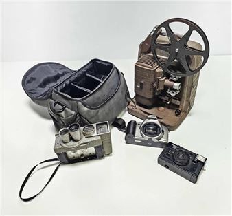 Two cameras in a carry case together with a Revere camera and a Bell & Howell projector - Howell
