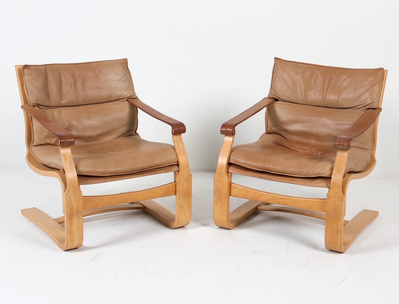Artwork by Ake Fribyter, ATTR. AKE FRIBYTTER LEATHER LOUNGE CHAIRS C. 1970S, Made of bentwood frames with tan leather upholstery
