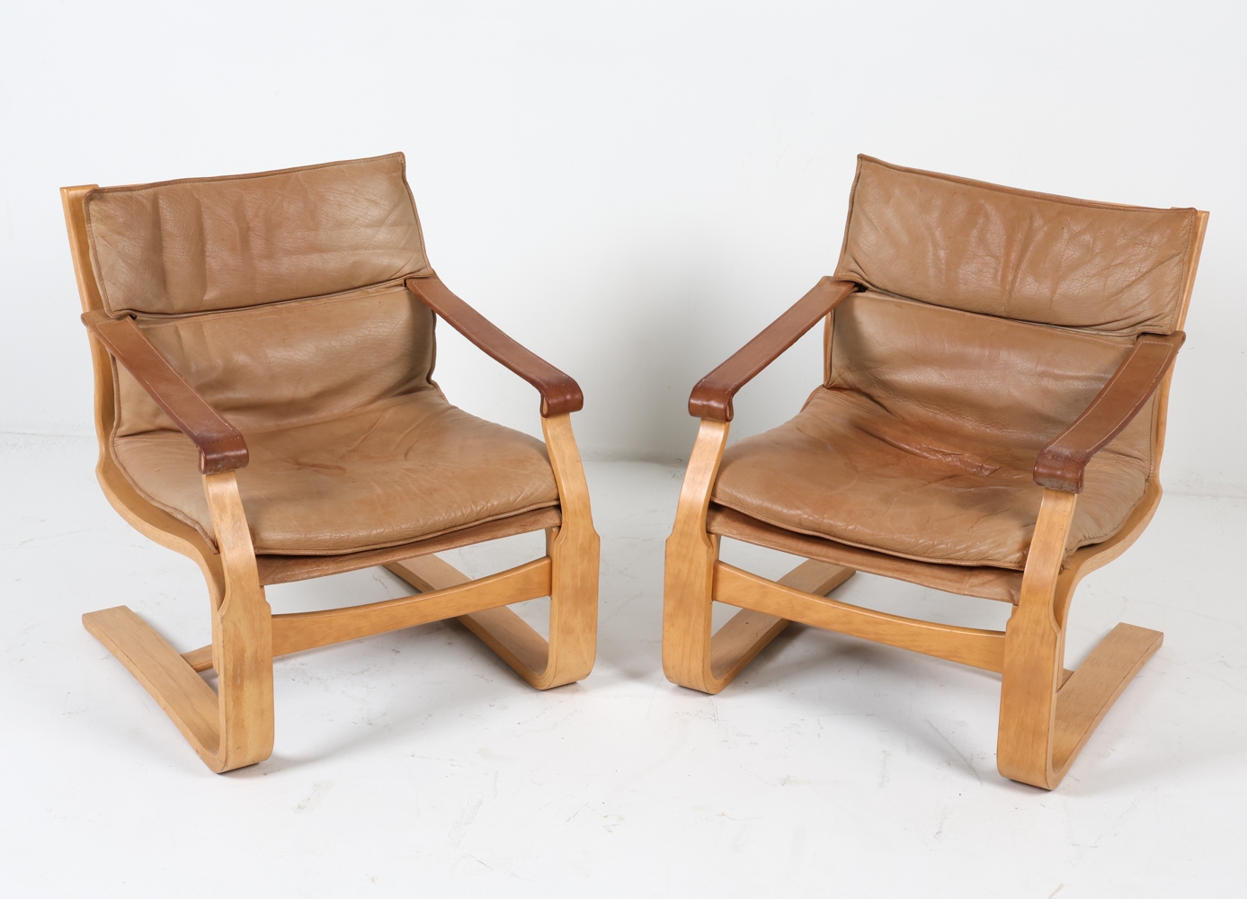 Artwork by Ake Fribyter, ATTR. AKE FRIBYTTER LEATHER LOUNGE CHAIRS C. 1970S, Made of bentwood frames with tan leather upholstery