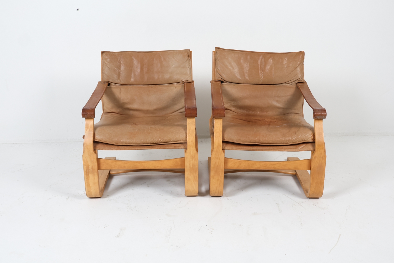 Artwork by Ake Fribyter, ATTR. AKE FRIBYTTER LEATHER LOUNGE CHAIRS C. 1970S, Made of bentwood frames with tan leather upholstery