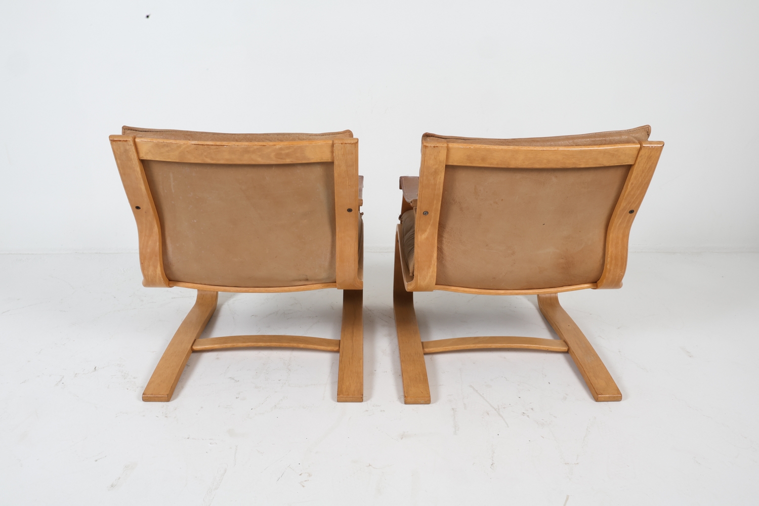 Artwork by Ake Fribyter, ATTR. AKE FRIBYTTER LEATHER LOUNGE CHAIRS C. 1970S, Made of bentwood frames with tan leather upholstery