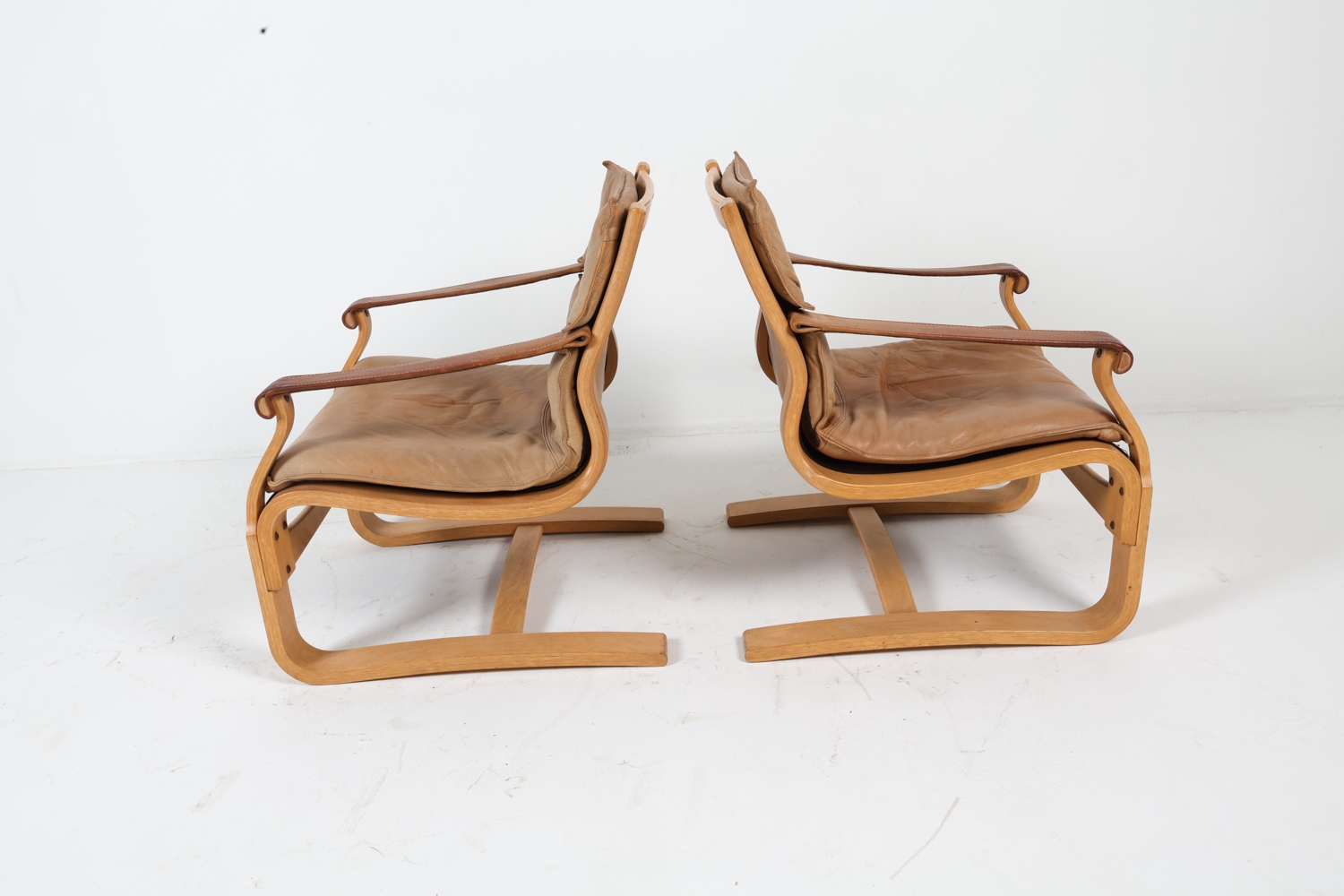 Artwork by Ake Fribyter, ATTR. AKE FRIBYTTER LEATHER LOUNGE CHAIRS C. 1970S, Made of bentwood frames with tan leather upholstery