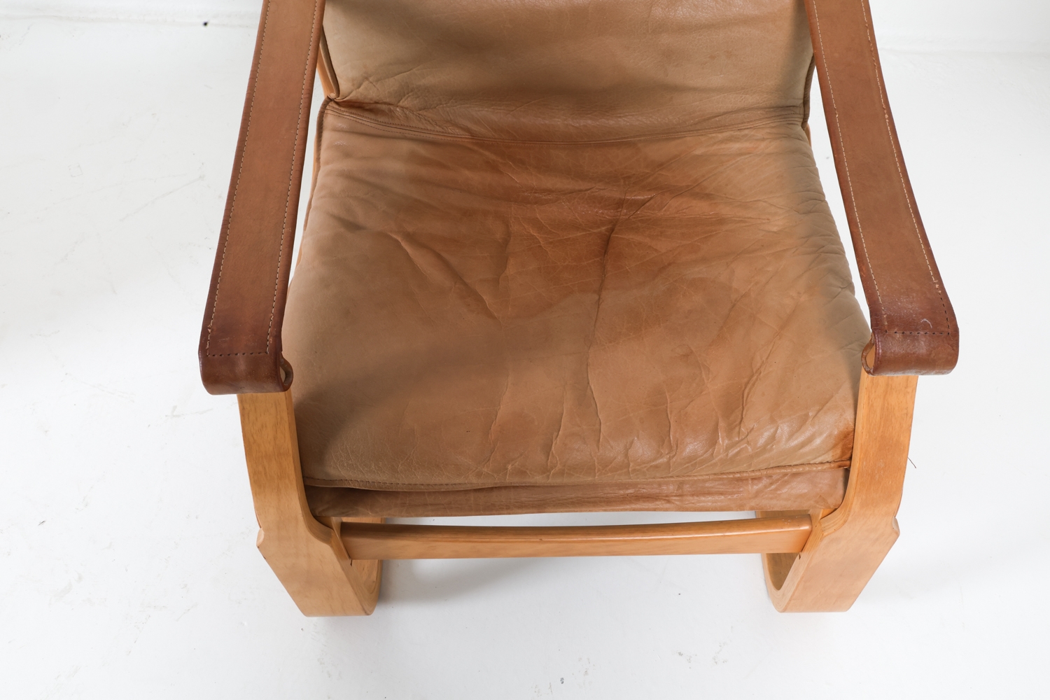 Artwork by Ake Fribyter, ATTR. AKE FRIBYTTER LEATHER LOUNGE CHAIRS C. 1970S, Made of bentwood frames with tan leather upholstery