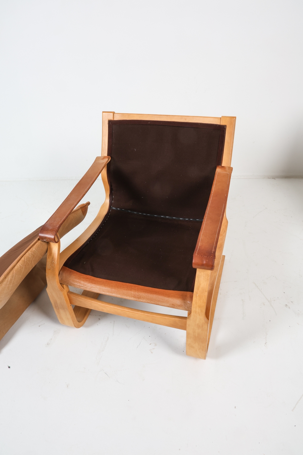 Artwork by Ake Fribyter, ATTR. AKE FRIBYTTER LEATHER LOUNGE CHAIRS C. 1970S, Made of bentwood frames with tan leather upholstery