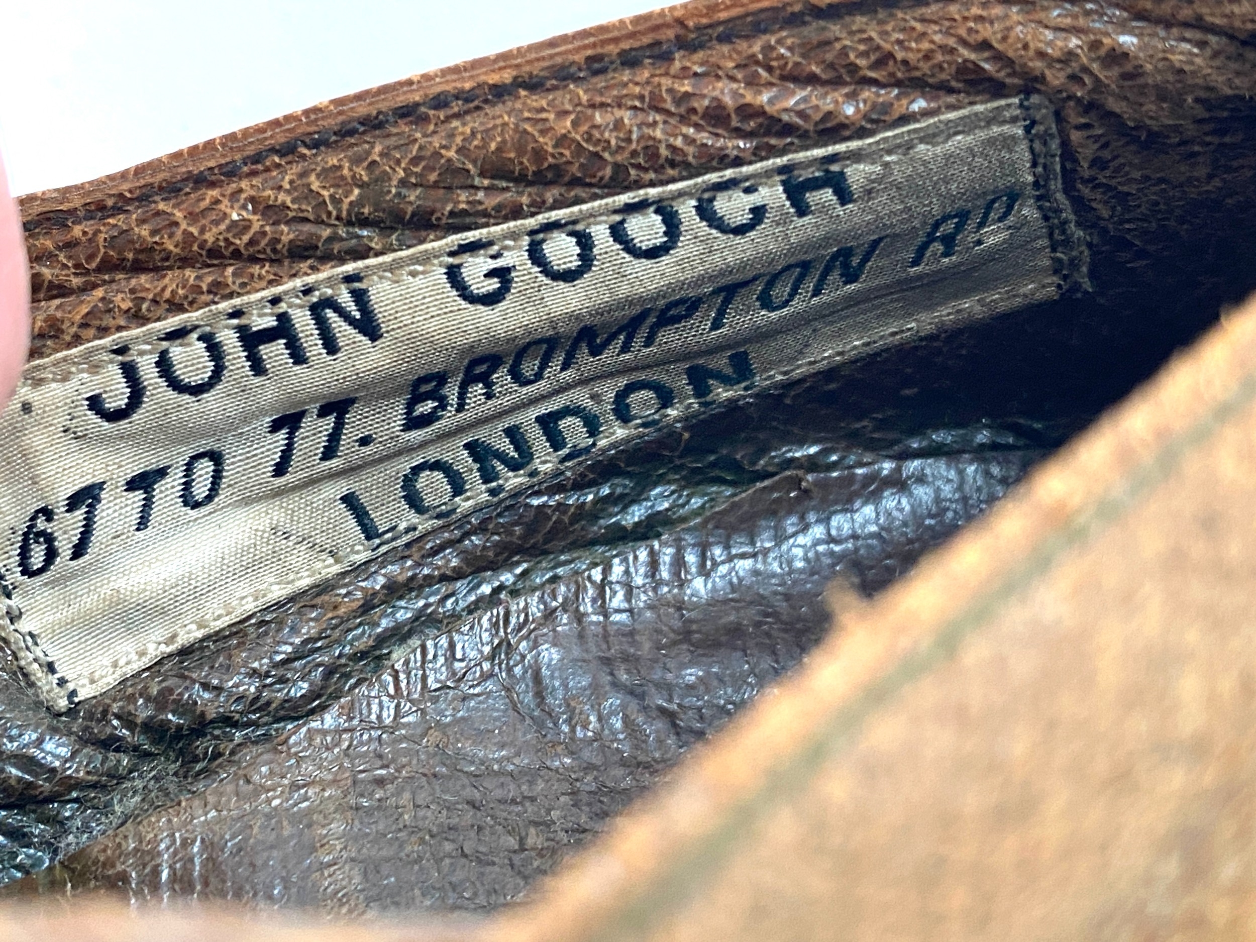 Artwork by Gooch, A lateth century  child's shoe c with  repousse buckle, bears label for John Gooch Brompton Rd, Made of gilt metal