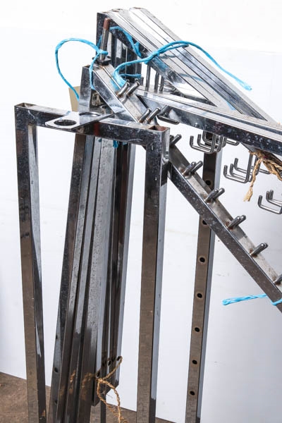 Assembly | A portable clothing rack in silver tone with adjustable ...