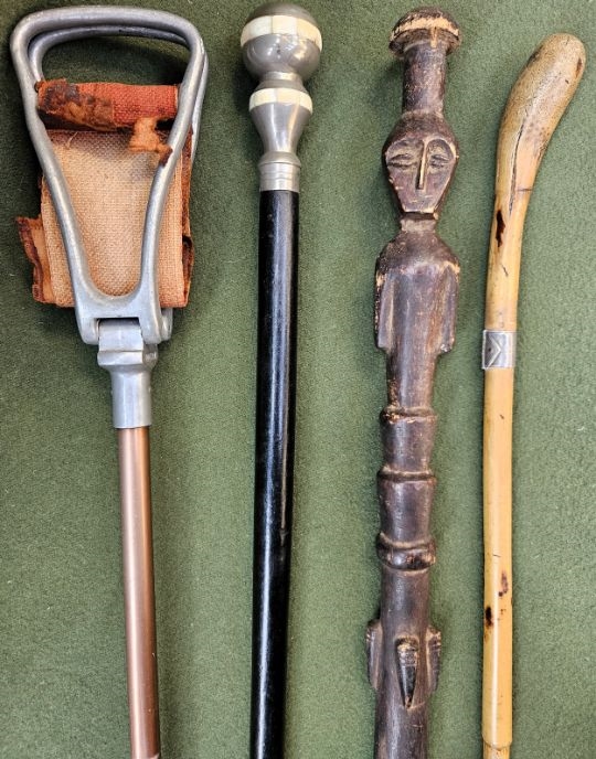 Unknown | Vintage ebonised walking stick with screw off top, carved ...