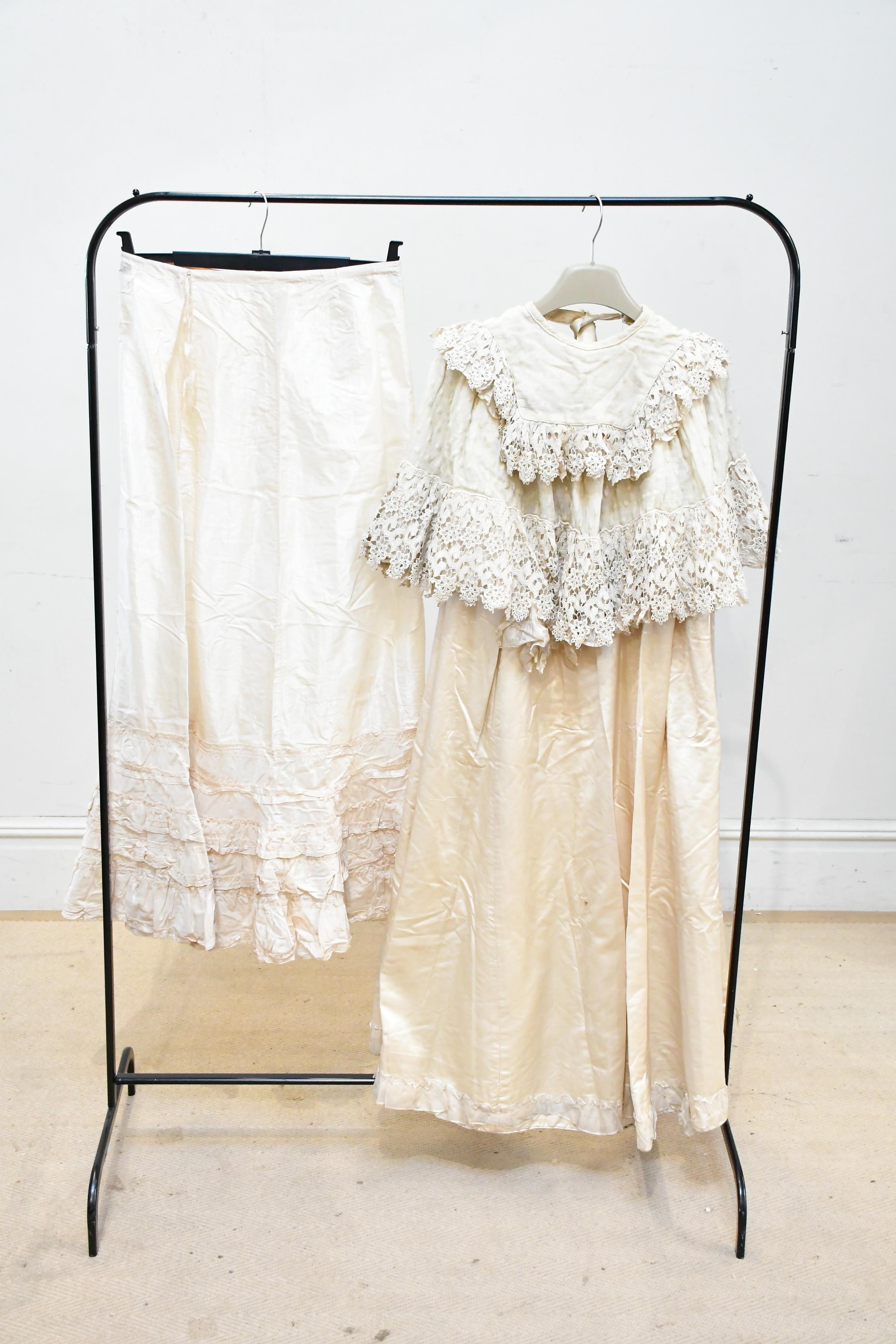 Artwork by Emanuel, trimmed with lace, Made of silk