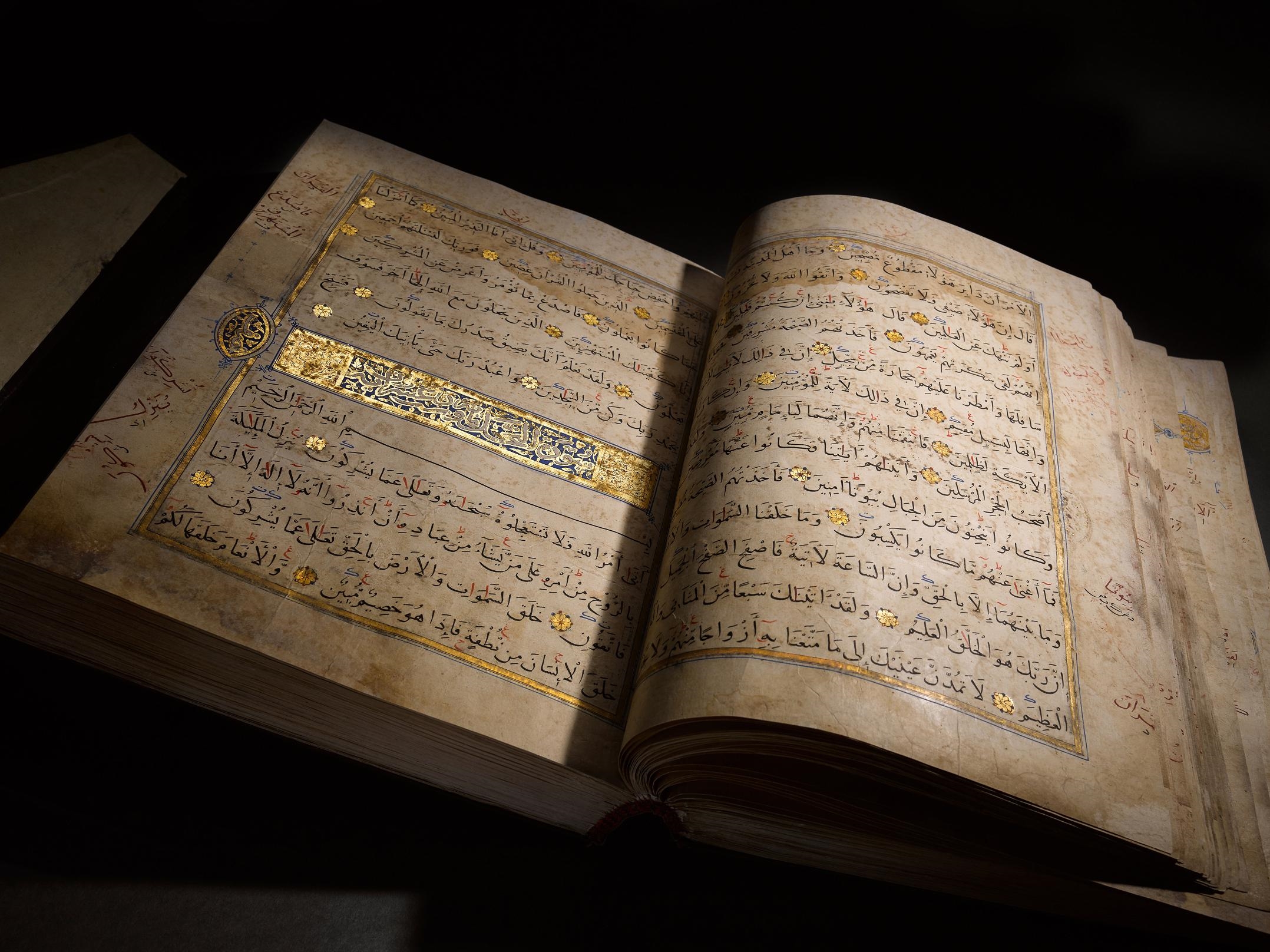 Artwork by Muhammad Abu Al-fadl Ibn ‘abd Al-wahhab Al-a’raj, A large illuminated Mamluk Qur’an, Made of Arabic manuscript on paper, 293 leaves, plus 3 flyleaves, 13 lines to the page written in naskh in black ink, verses separated by gold rosettes with red and blue dots, surah headings in large white thuluth within illuminated panels, further text divisions marked by illuminated marginal medallions, f.1a with 16th century Ottoman illuminated frontispiece, f.1b and f.2a with double page illuminated frontispiece framing text written in blue and gold