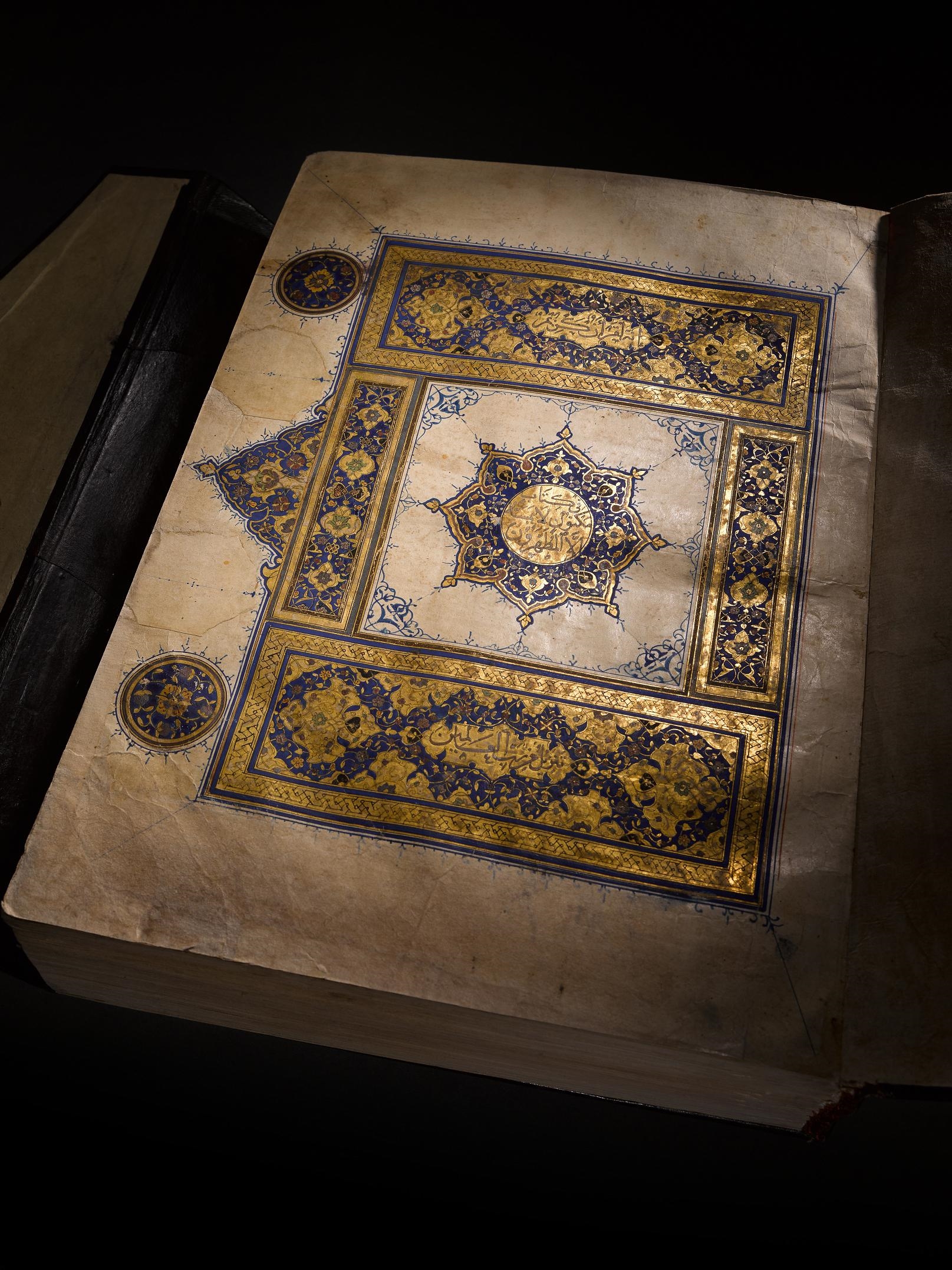 Artwork by Muhammad Abu Al-fadl Ibn ‘abd Al-wahhab Al-a’raj, A large illuminated Mamluk Qur’an, Made of Arabic manuscript on paper, 293 leaves, plus 3 flyleaves, 13 lines to the page written in naskh in black ink, verses separated by gold rosettes with red and blue dots, surah headings in large white thuluth within illuminated panels, further text divisions marked by illuminated marginal medallions, f.1a with 16th century Ottoman illuminated frontispiece, f.1b and f.2a with double page illuminated frontispiece framing text written in blue and gold