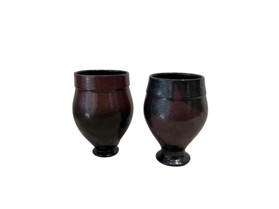 Small stoneware ovoid vase on pedestal, decorated with black enamels on a reddish-brown ground by Robert Deblander