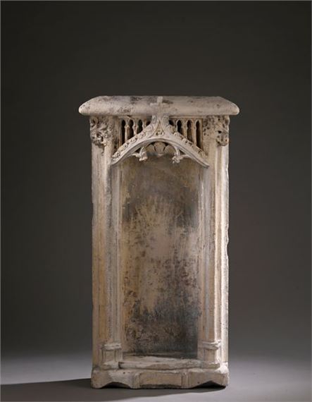 France, late 15th century Flamboyantly decorated niche in limestone. Wear and accidents 72 x 40 x 15 cm This elegant niche with its cul-de-four base originally featured a medium-sized sculpture of a saint, identified by a cartouche in the lower part that has now been erased. The divine representation stood beneath a canopy made up of an infill section with eight openings in the form of round-arched bays. On the front, a pediment with vegetal crosses is topped by a finial at the top. At the botto by French School, 15th Century