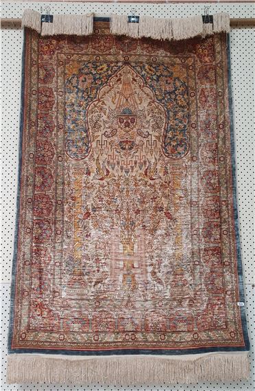 A TURKISH HEREKE SILK PRAYER RUG